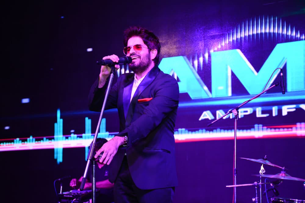 MOhit performing on stage with dramatic lighting